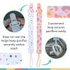 image:imageNuby Pacifinder Baby Pacifier Clip  2Pack  Pacifier Holder Clip with Convenient Hook Loop  Blue Dots and Green DinoPink Flowers  White Polka Dots