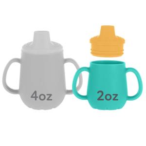 image:imageNuby First Training Cup  Silicone Cup with FreeFlow Spout and EasyGrip Design  2 oz  6 Months  Purple and PinkYellow  Aqua
